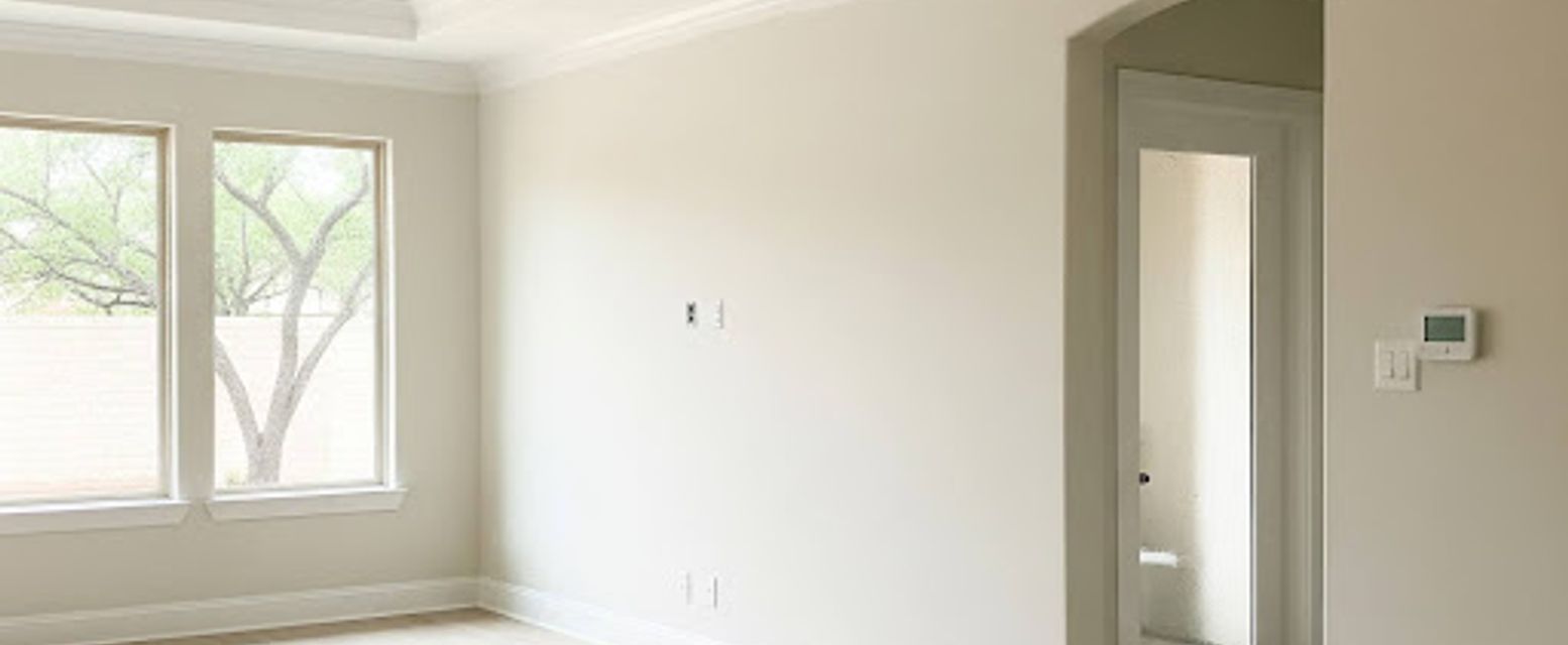 Painter touching up a scuffed interior wall